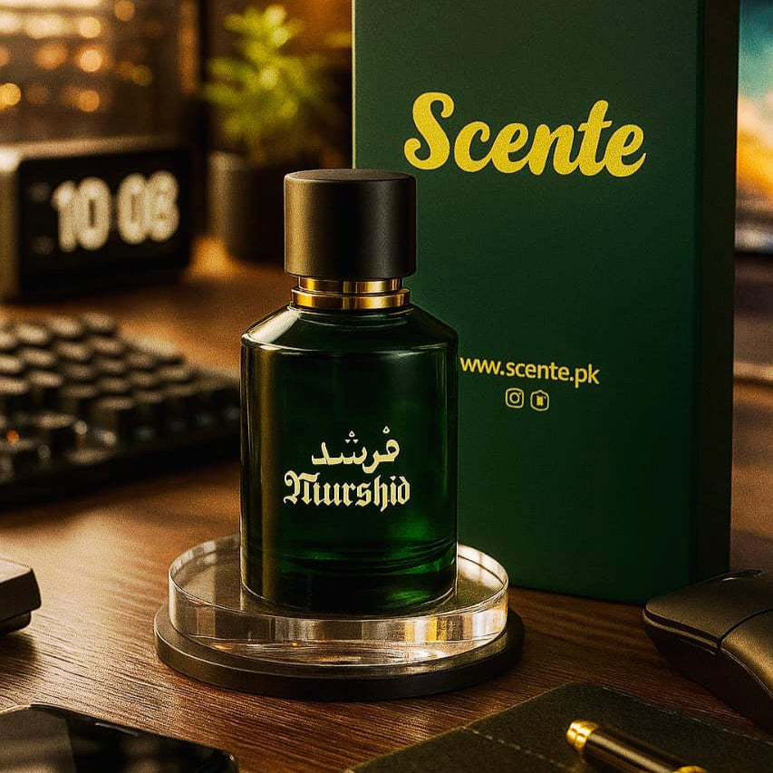 Green perfume bottle with 'Scente' packaging on a desk